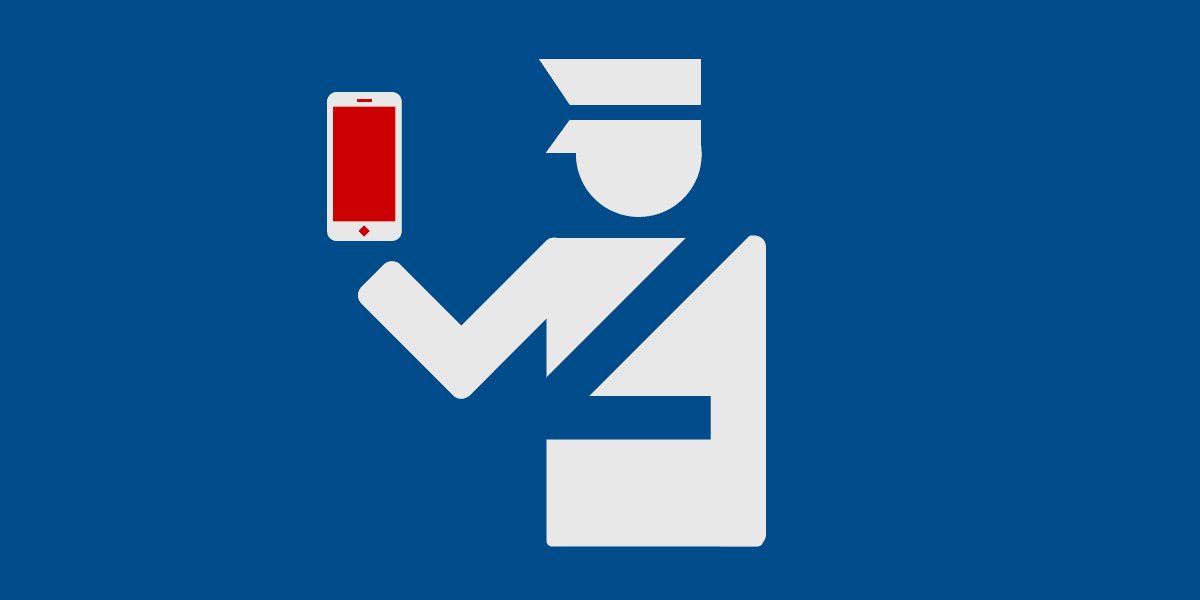 A customs officer inspects a smart phone.