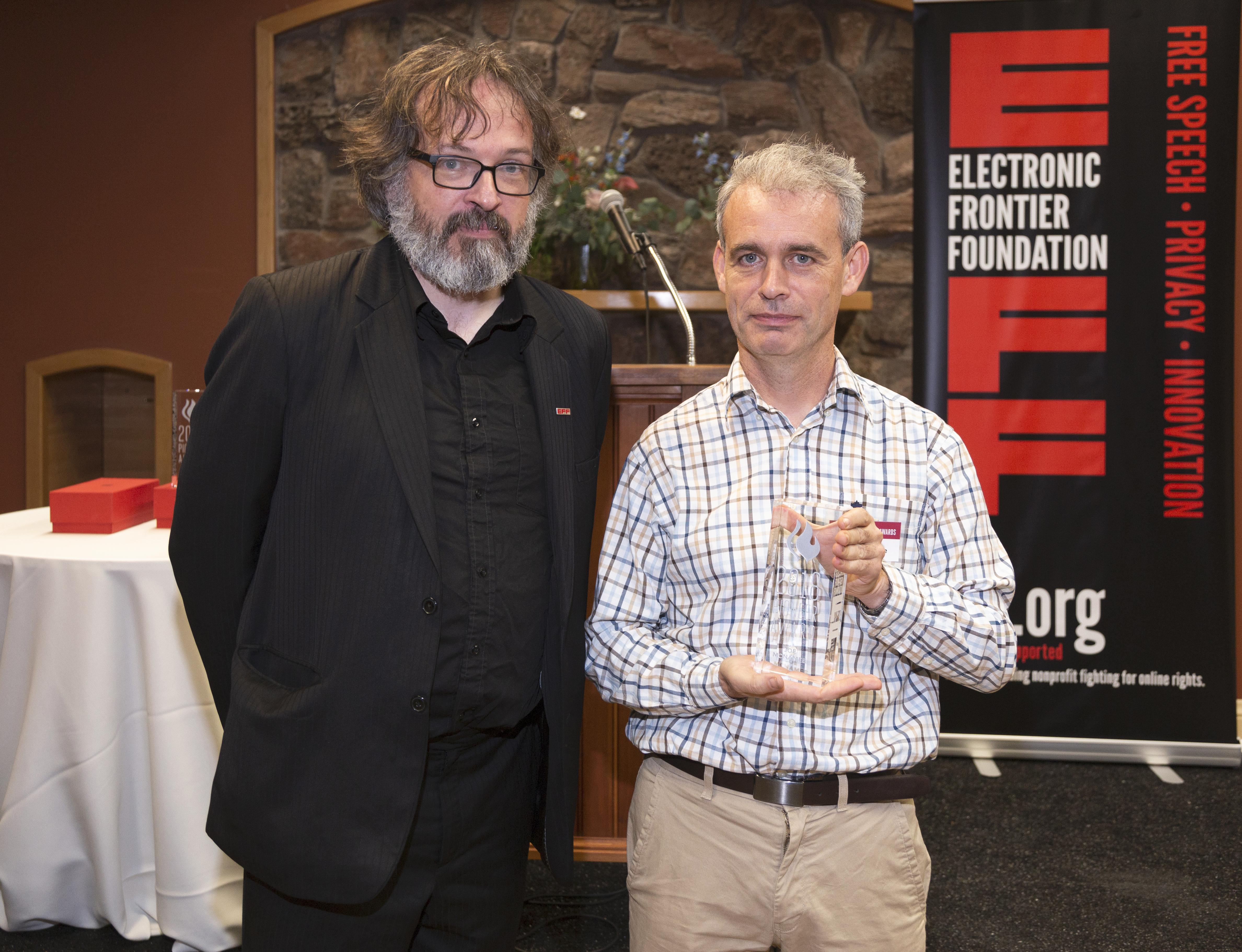 EFF's International Director, Danny O'Brien and "Barlow" winner Joe McNamee, pose with Joe's award..