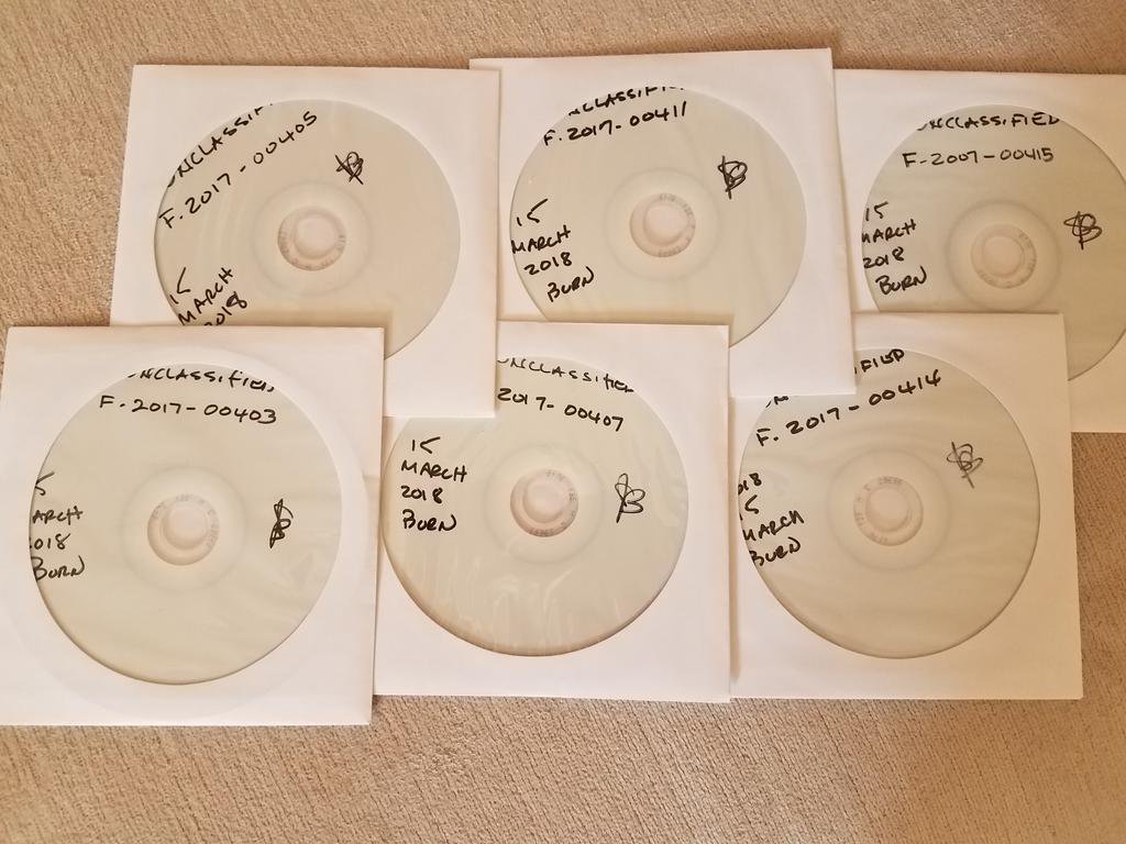 Six CDs in white paper cases