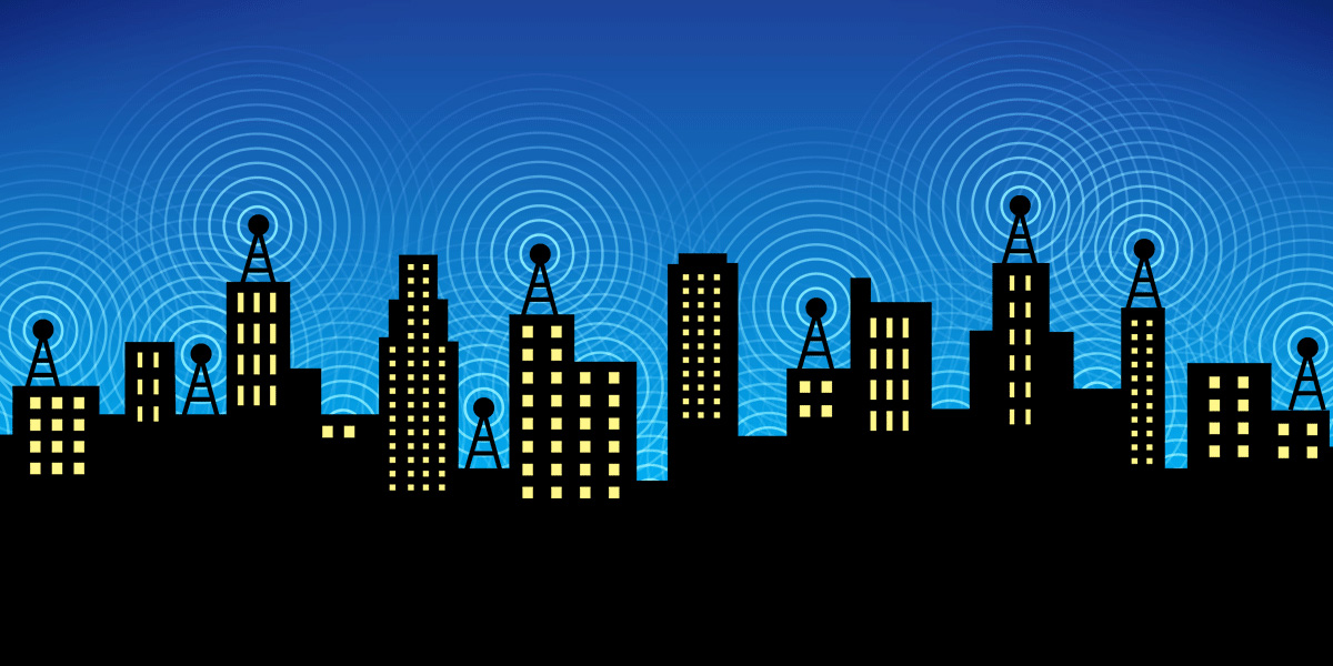 A city skyline, with overlapping wifi signals in the night sky.