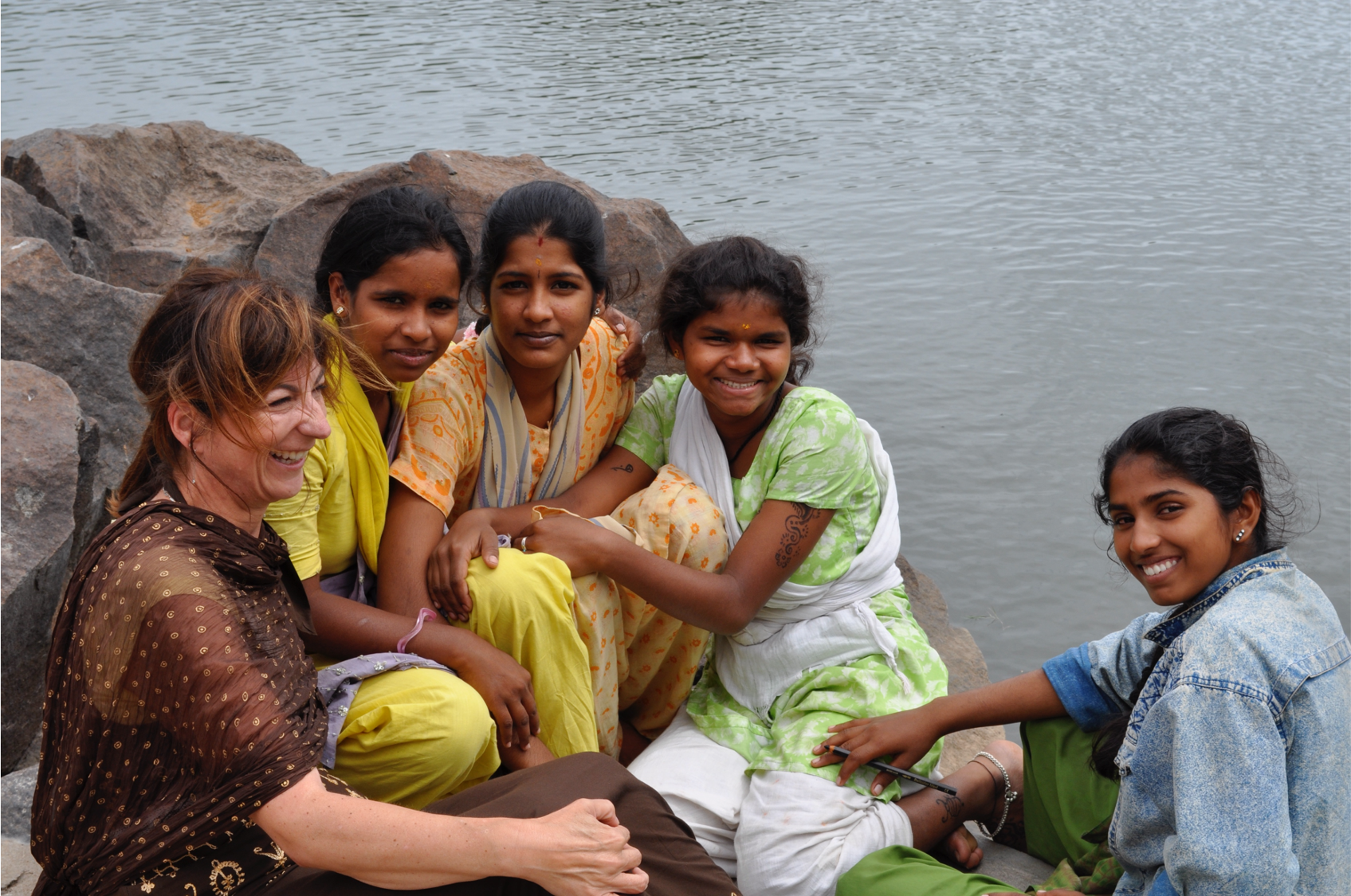 a picture of pam dixon alongside several young women 